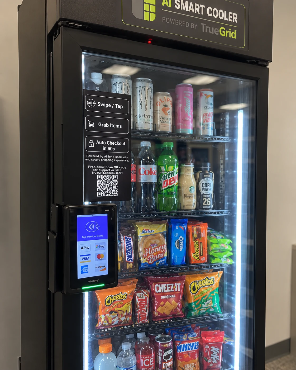 Close-up of a TrueGrid Smart AI Cooler payment terminal and stocked shelves